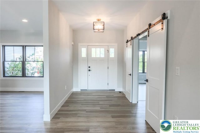 448 Long Lane Rd, Lehigh Twp, PA 18088 - foyer featuring a barn door, wood finished floors, baseboards, and recessed lighting