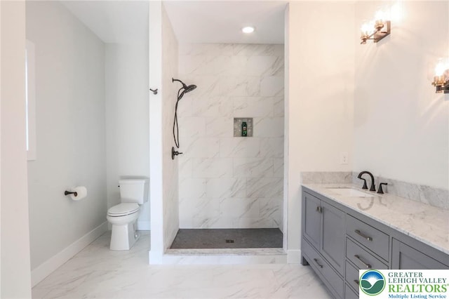448 Long Lane Rd, Lehigh Twp, PA 18088 - bathroom with marble look tile flooring, baseboards, a marble finish shower, toilet, and vanity