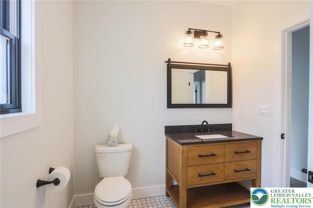 448 Long Lane Rd, Lehigh Twp, PA 18088 - bathroom featuring toilet, vanity, and baseboards