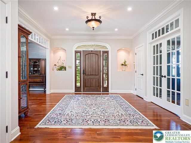 5355 Saucon Ridge Rd, Upper Saucon Twp, PA 18036 - entryway featuring wood finished floors, ornamental molding, arched walkways, baseboards, and recessed lighting