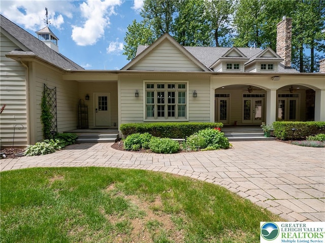 5355 Saucon Ridge Rd, Upper Saucon Twp, PA 18036 - view of front of property with french doors, a ceiling fan, and a chimney
