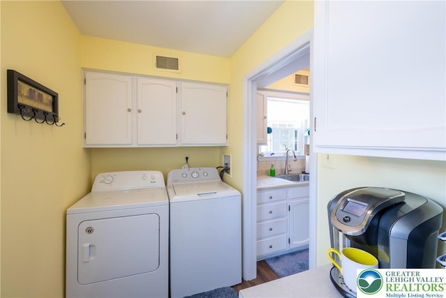 2765 Rolling Green Pl, Lower Macungie Twp, PA 18062 - washroom featuring cabinet space, independent washer and dryer, and dark wood-type flooring