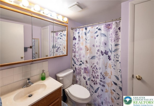 2765 Rolling Green Pl, Lower Macungie Twp, PA 18062 - full bathroom with vanity, backsplash, toilet, and a shower with shower curtain