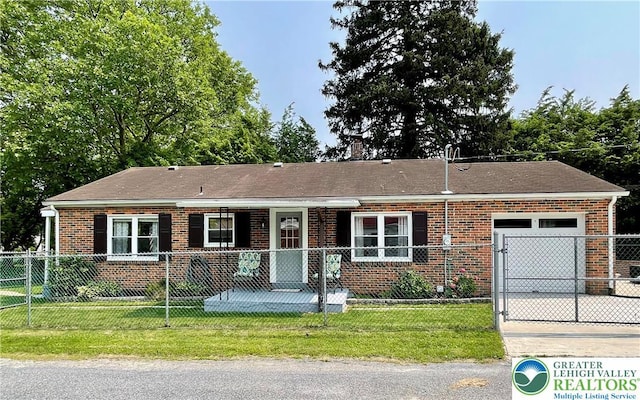 938 N Broad St, Allentown City, PA 18104 - view of front of home with an attached garage, brick siding, and driveway
