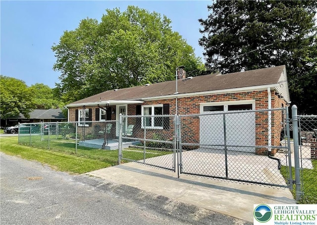 938 N Broad St, Allentown City, PA 18104 - view of front of home with brick siding, a fenced front yard, and roof with shingles
