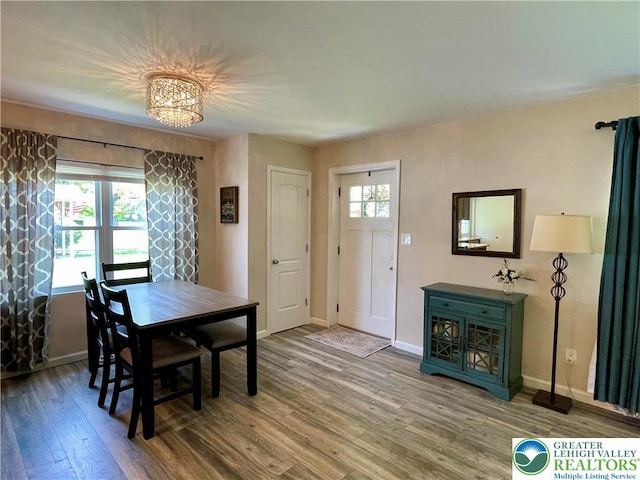 938 N Broad St, Allentown City, PA 18104 - dining room with wood finished floors, a chandelier, and baseboards