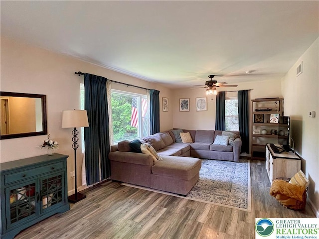 938 N Broad St, Allentown City, PA 18104 - living area featuring wood finished floors, healthy amount of natural light, and a ceiling fan