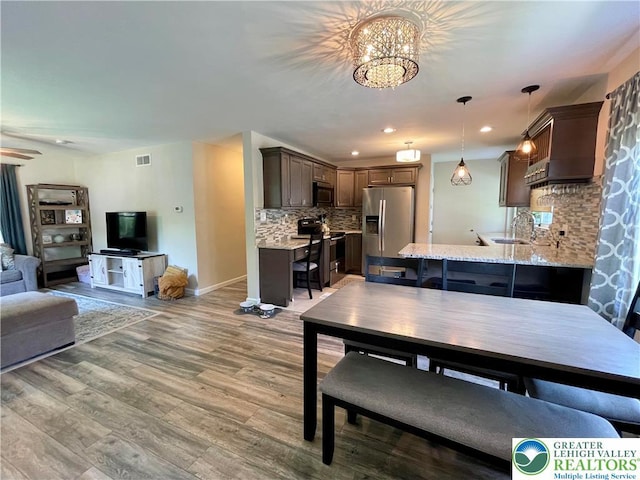 938 N Broad St, Allentown City, PA 18104 - dining space with baseboards, a chandelier, light wood-style floors, and recessed lighting