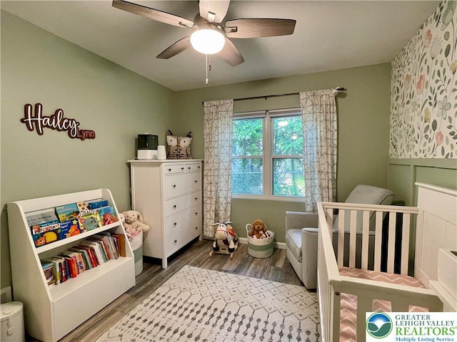 938 N Broad St, Allentown City, PA 18104 - bedroom with a nursery area, wood finished floors, ceiling fan, and baseboards