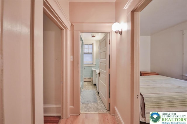 30 S 16th St, Wilson Boro, PA 18042 - hall with wood finished floors and a baseboard heating unit