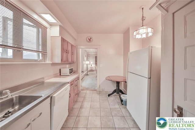 30 S 16th St, Wilson Boro, PA 18042 - kitchen featuring white appliances, light countertops, light tile patterned floors, and hanging light fixtures