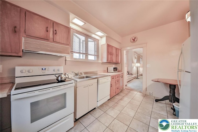 30 S 16th St, Wilson Boro, PA 18042 - kitchen featuring white appliances, range hood, light countertops, and light tile patterned flooring
