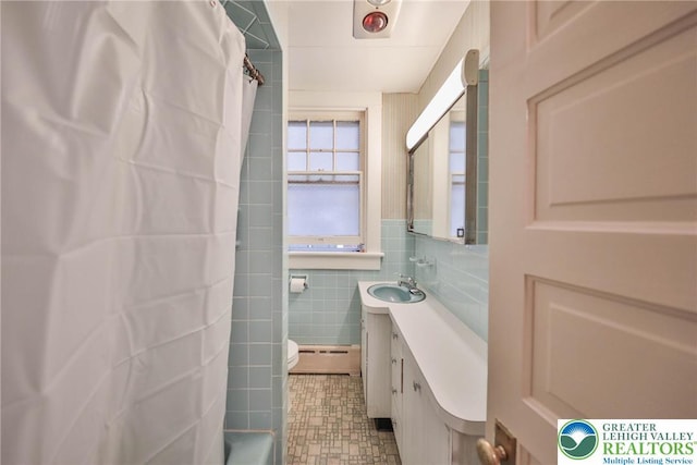 30 S 16th St, Wilson Boro, PA 18042 - bathroom with a baseboard radiator, vanity, and tile walls