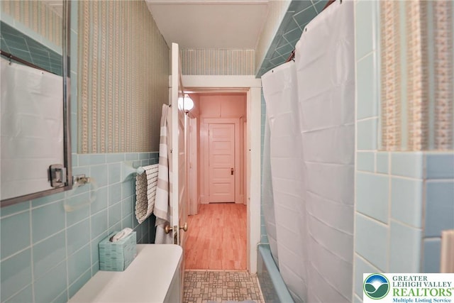 30 S 16th St, Wilson Boro, PA 18042 - bathroom featuring wallpapered walls, tile walls, and shower / tub combo