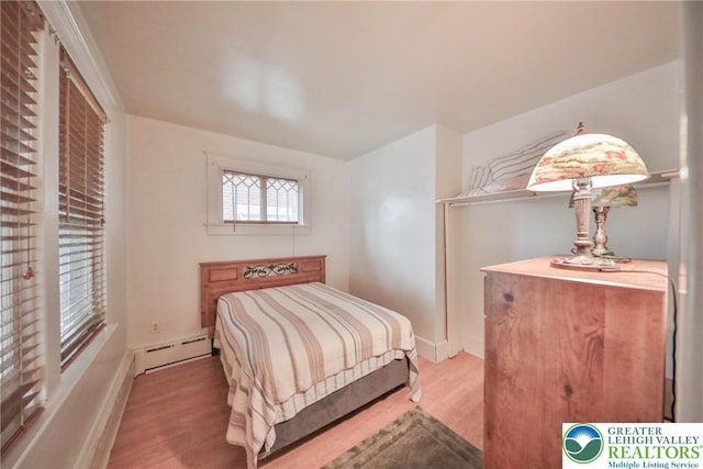 30 S 16th St, Wilson Boro, PA 18042 - bedroom featuring a baseboard heating unit and wood finished floors