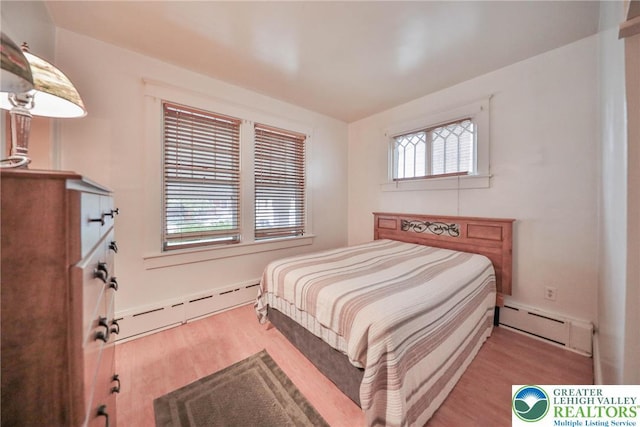 30 S 16th St, Wilson Boro, PA 18042 - bedroom featuring baseboard heating and wood finished floors