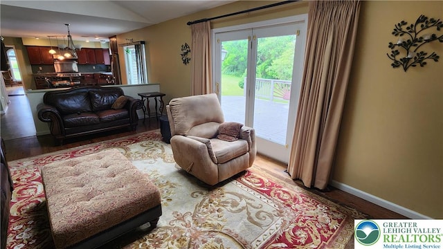 391 W Mayfield Cir, Lower Nazareth Twp, PA 18020 - living area featuring light wood finished floors, vaulted ceiling, and baseboards