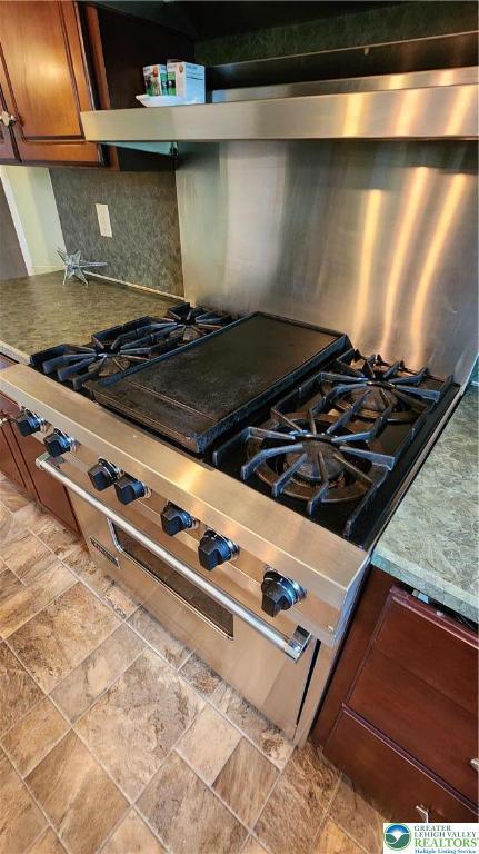 391 W Mayfield Cir, Lower Nazareth Twp, PA 18020 - kitchen view of brown cabinets and stainless steel stove