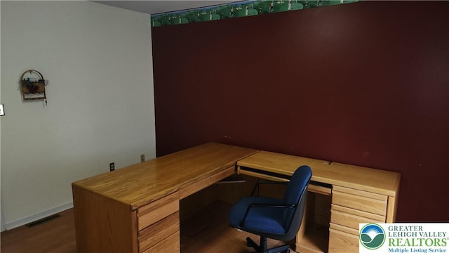 391 W Mayfield Cir, Lower Nazareth Twp, PA 18020 - office area featuring wood finished floors, built in desk, and baseboards