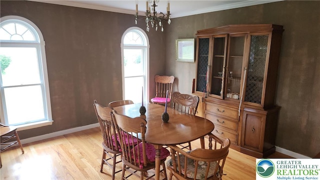 391 W Mayfield Cir, Lower Nazareth Twp, PA 18020 - dining space featuring light wood-style flooring, baseboards, a chandelier, and ornamental molding