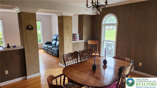 391 W Mayfield Cir, Lower Nazareth Twp, PA 18020 - dining space featuring wood finished floors, healthy amount of natural light, baseboards, ornamental molding, and a chandelier