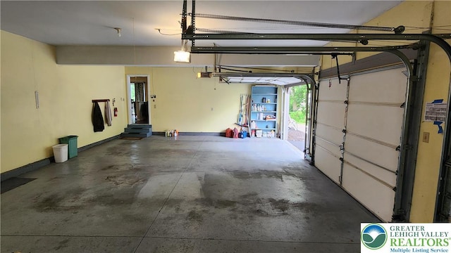 391 W Mayfield Cir, Lower Nazareth Twp, PA 18020 - garage featuring a garage door opener