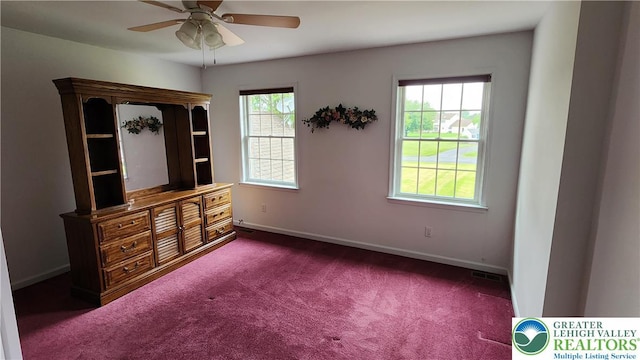 391 W Mayfield Cir, Lower Nazareth Twp, PA 18020 - unfurnished bedroom featuring dark colored carpet, baseboards, and ceiling fan