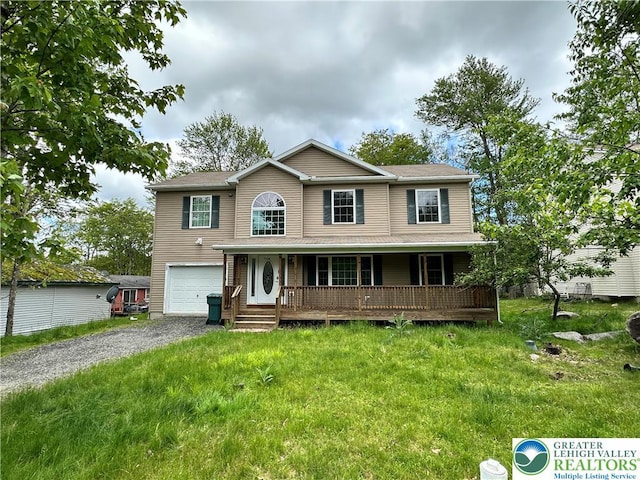 7190 Rimrock Dr, Coolbaugh Twp, PA 18466 - view of front of home featuring driveway, an attached garage, and covered porch