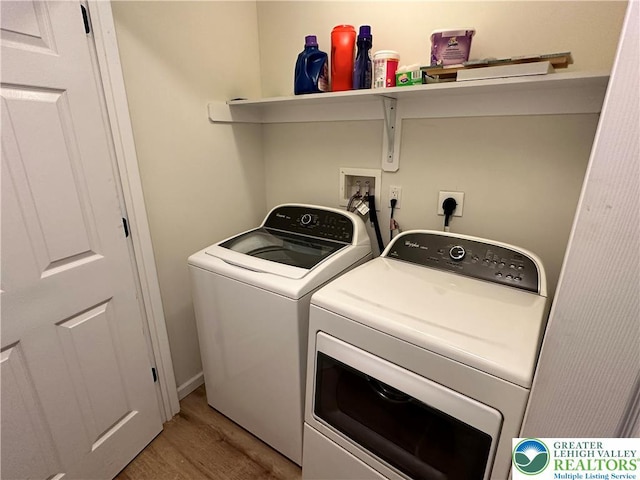 7190 Rimrock Dr, Coolbaugh Twp, PA 18466 - laundry area with separate washer and dryer and light wood-type flooring