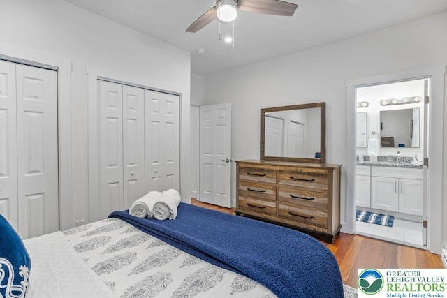 22 Petrarch Trl, Penn Forest Twp, PA 18210 - bedroom with wood finished floors, ensuite bathroom, two closets, ceiling fan, and a sink