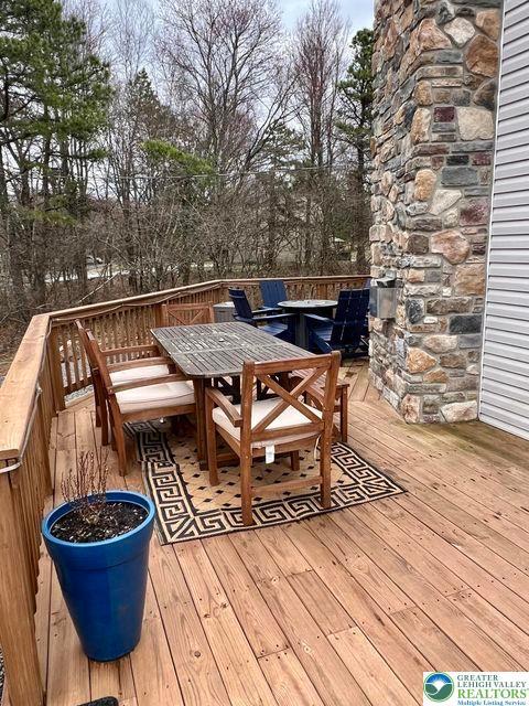 22 Petrarch Trl, Penn Forest Twp, PA 18210 - wooden terrace with outdoor dining area