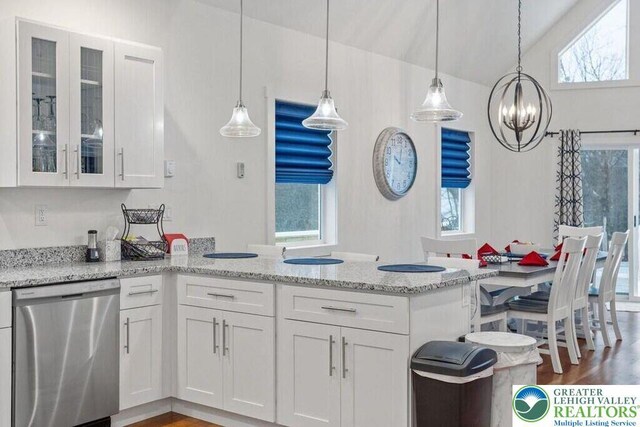 22 Petrarch Trl, Penn Forest Twp, PA 18210 - kitchen with dishwasher, a chandelier, a peninsula, white cabinets, and healthy amount of natural light