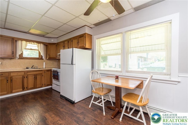 2104 Schwab Ave, Lower Saucon Twp, PA 18015 - kitchen with white appliances, brown cabinetry, a paneled ceiling, a sink, and light countertops