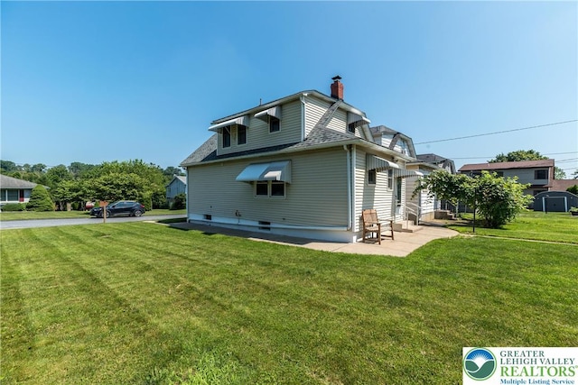 2104 Schwab Ave, Lower Saucon Twp, PA 18015 - back of property featuring a yard, a chimney, and a shingled roof