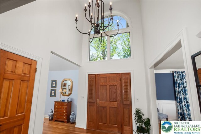 1560 Surrey Rd, Lower Saucon Twp, PA 18015 - foyer with a high ceiling, a chandelier, and wood finished floors