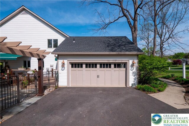 1560 Surrey Rd, Lower Saucon Twp, PA 18015 - view of side of home with asphalt driveway, a shingled roof, and an attached garage