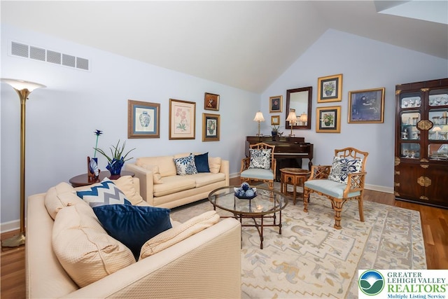 1560 Surrey Rd, Lower Saucon Twp, PA 18015 - living area with wood finished floors, vaulted ceiling, and baseboards