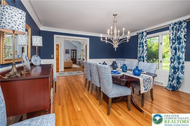 1560 Surrey Rd, Lower Saucon Twp, PA 18015 - dining space featuring a chandelier, a wainscoted wall, crown molding, and light wood finished floors