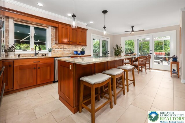 1560 Surrey Rd, Lower Saucon Twp, PA 18015 - kitchen with a sink, dishwasher, brown cabinetry, a center island, and ceiling fan