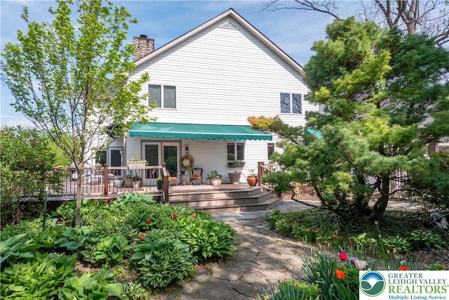 1560 Surrey Rd, Lower Saucon Twp, PA 18015 - back of property featuring a chimney and a wooden deck