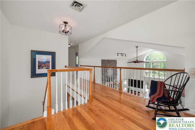 1560 Surrey Rd, Lower Saucon Twp, PA 18015 - corridor with wood finished floors, an upstairs landing, vaulted ceiling, and a chandelier