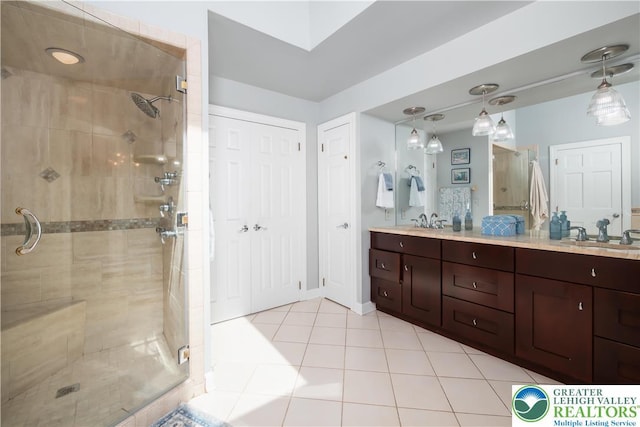 1560 Surrey Rd, Lower Saucon Twp, PA 18015 - full bath with a stall shower, double vanity, tile patterned flooring, and baseboards