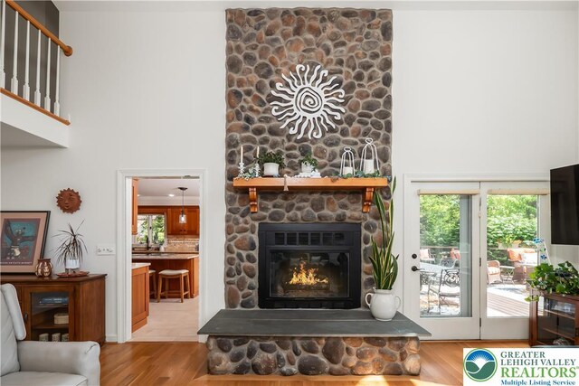 1560 Surrey Rd, Lower Saucon Twp, PA 18015 - living room featuring a towering ceiling, wood finished floors, and a fireplace