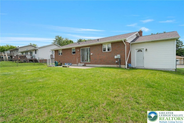 94 Brader Dr, Luzerne, PA 18705 - rear view of house with brick siding, a chimney, and a patio