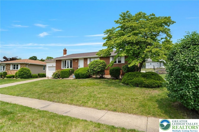 94 Brader Dr, Luzerne, PA 18705 - ranch-style house featuring an attached garage, brick siding, a front lawn, a chimney, and concrete driveway