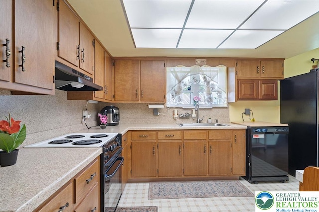 94 Brader Dr, Luzerne, PA 18705 - kitchen with black appliances, under cabinet range hood, a sink, light countertops, and light flooring