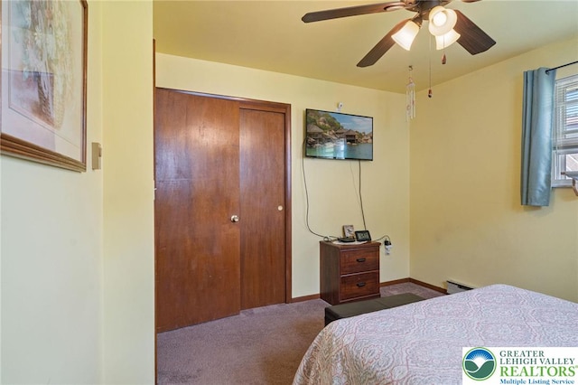94 Brader Dr, Luzerne, PA 18705 - bedroom featuring carpet, a baseboard heating unit, a closet, ceiling fan, and baseboards