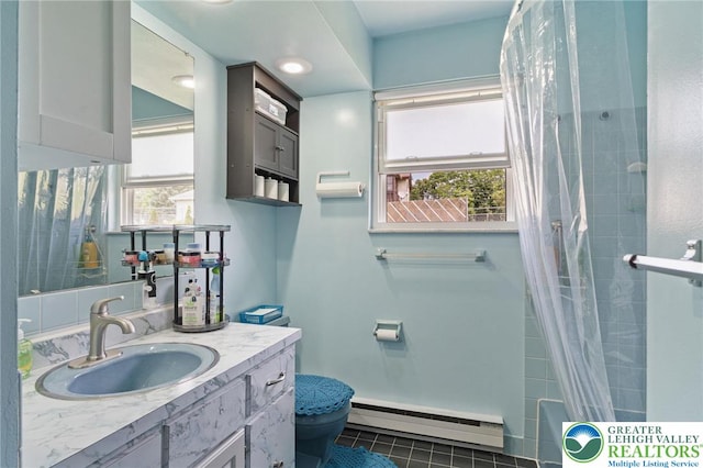 94 Brader Dr, Luzerne, PA 18705 - full bath featuring a baseboard radiator, healthy amount of natural light, toilet, and vanity