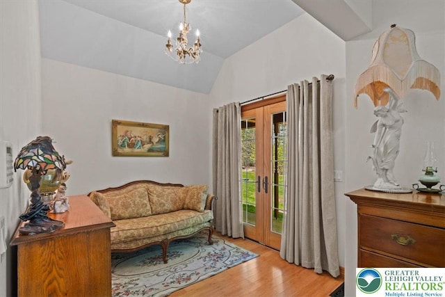 127 Timber Lake Dr, Barrett Twp, PA 18325 - sitting room with vaulted ceiling, french doors, light wood finished floors, and a chandelier