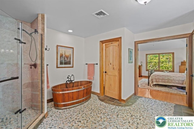 127 Timber Lake Dr, Barrett Twp, PA 18325 - bathroom with ensuite bath, a soaking tub, a shower stall, baseboards, and recessed lighting